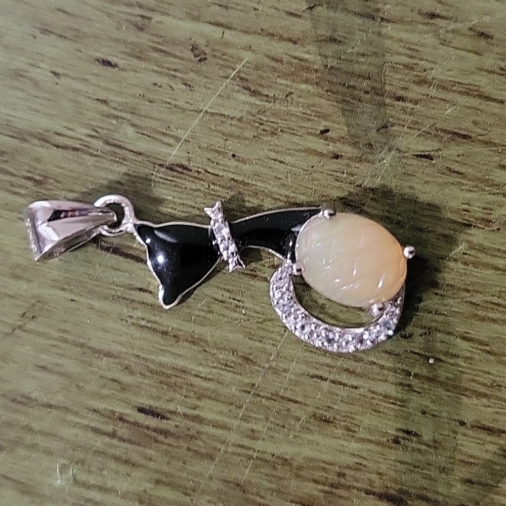 Carved Opal Pendant